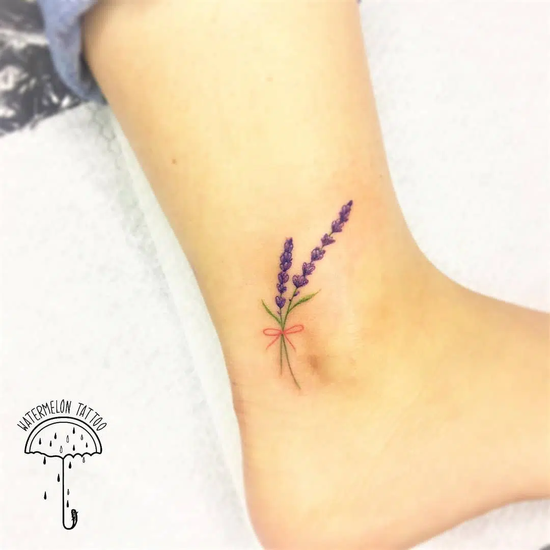 Dainty wee lavender by Noemi at Watermelon Tattoo.
