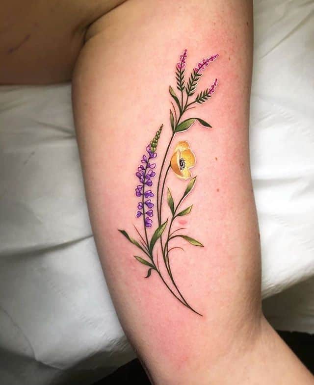 Wee bouquet of heather, lupin and a yellow poppy by Noemi at Watermelon Tattoo. 

