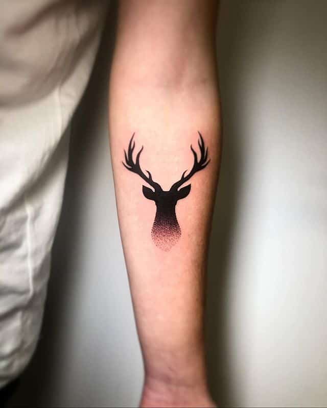 Grey Hook And Deer Antler Tattoo On Wrist